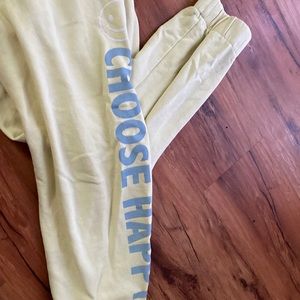 Yellow “be happy” sweats